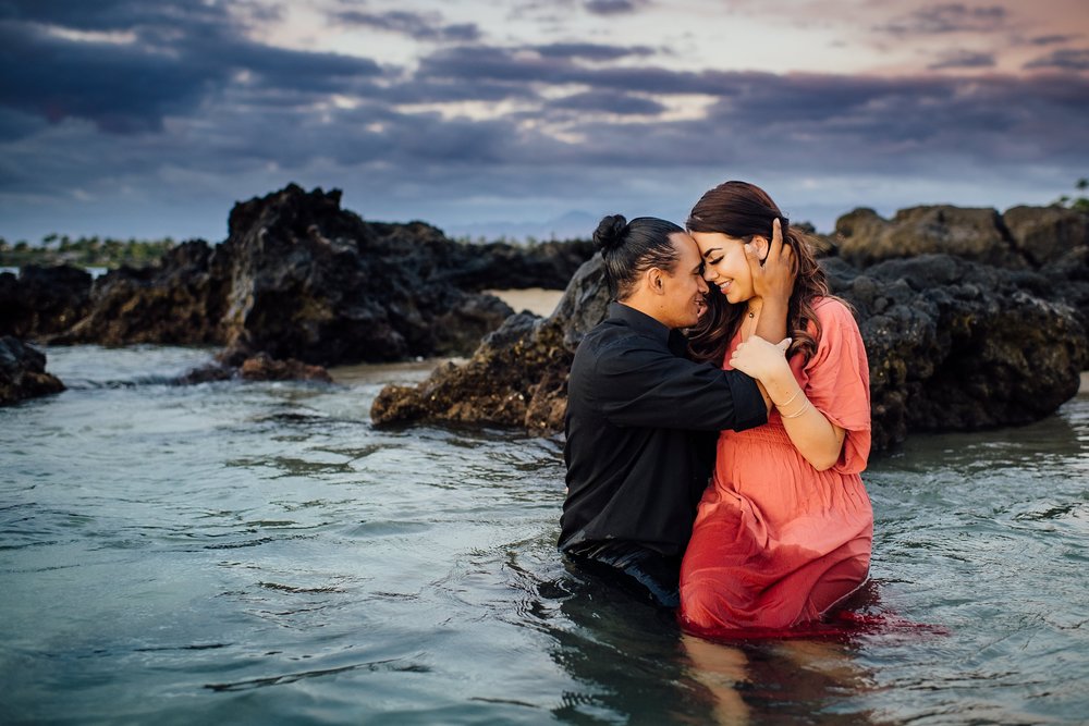 couple dipped in the waters during engagement session