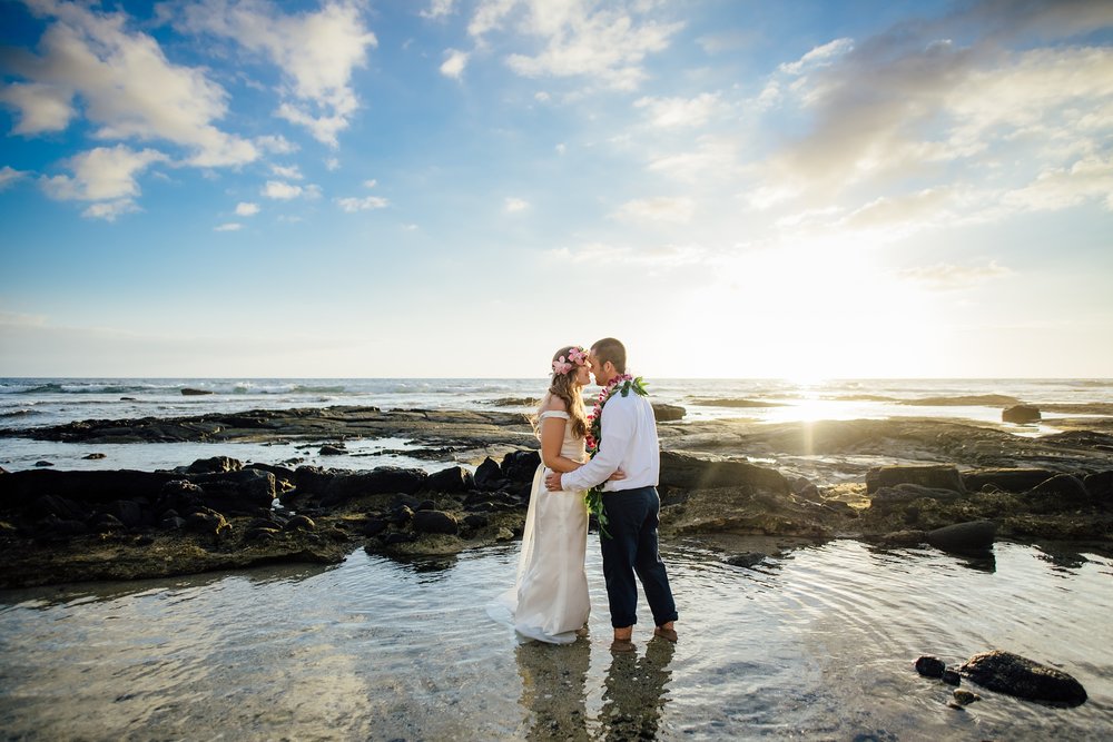 sweet newlyweds by the sea during their wedding in Kona