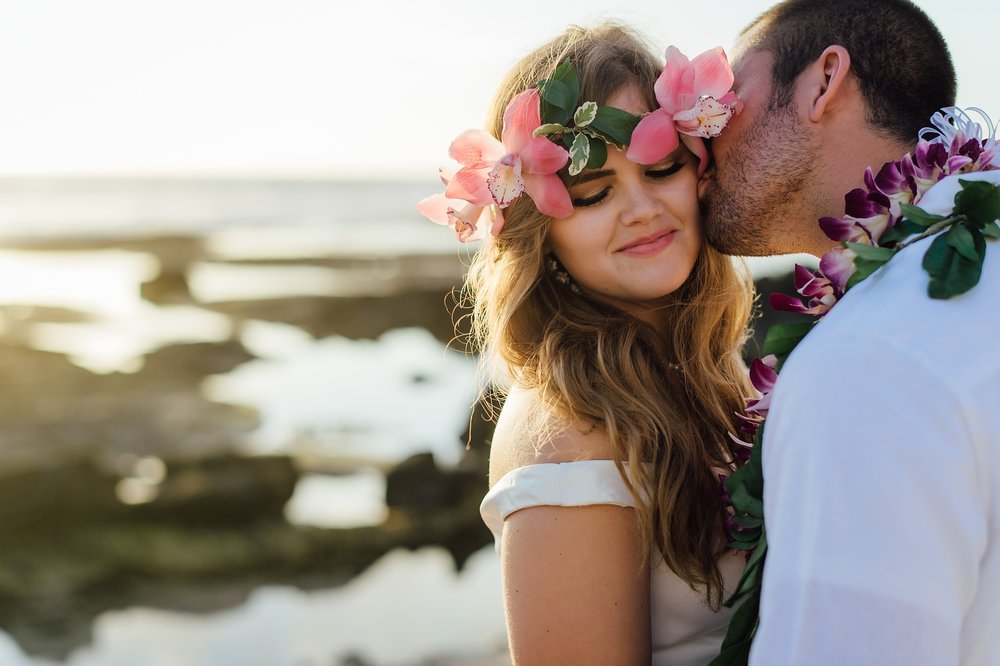 sweetest kiss for a bride from her groom during their hawaii wedding