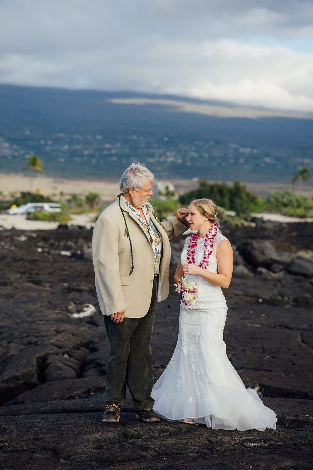 dad and bride on the lava rocks