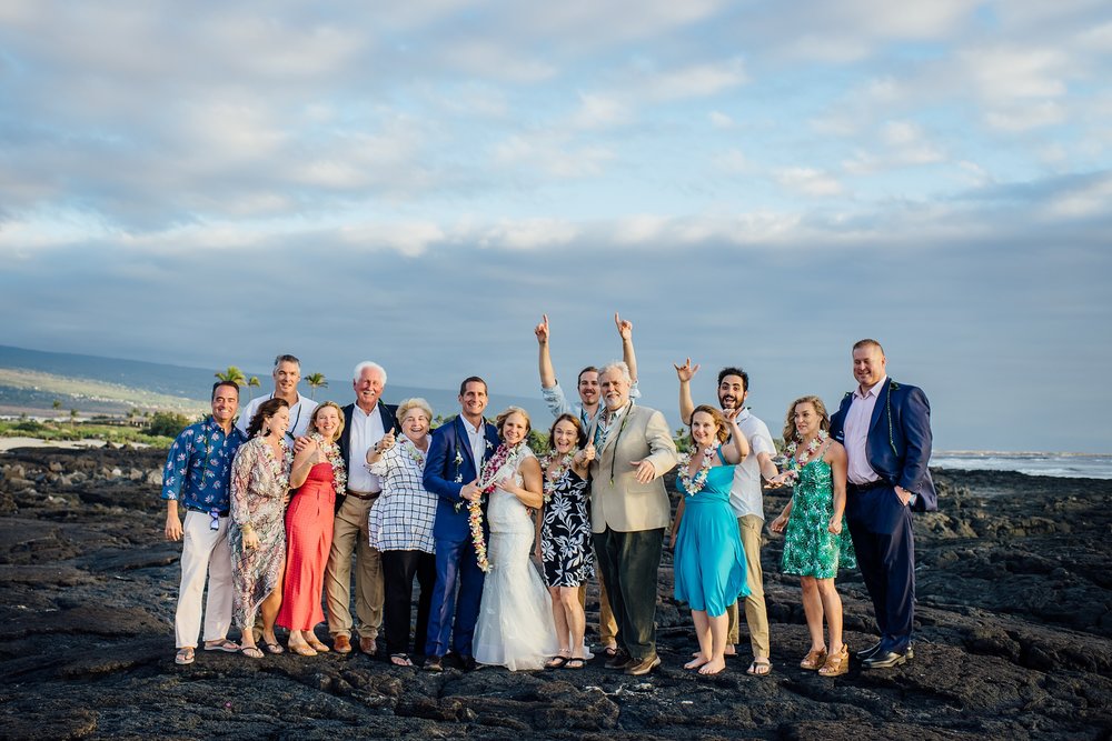 newlyweds with family during their Pine trees beach elopement
