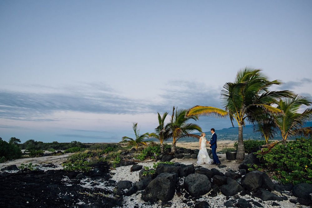 bride and groom against hualalai volcano