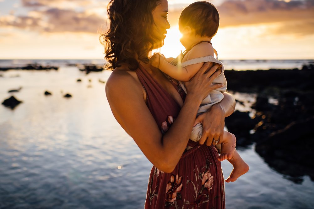 Emotive Motherhood moment on the beach at sunset