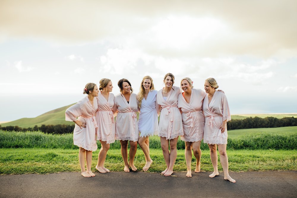 bride with bridesmaids in their robes