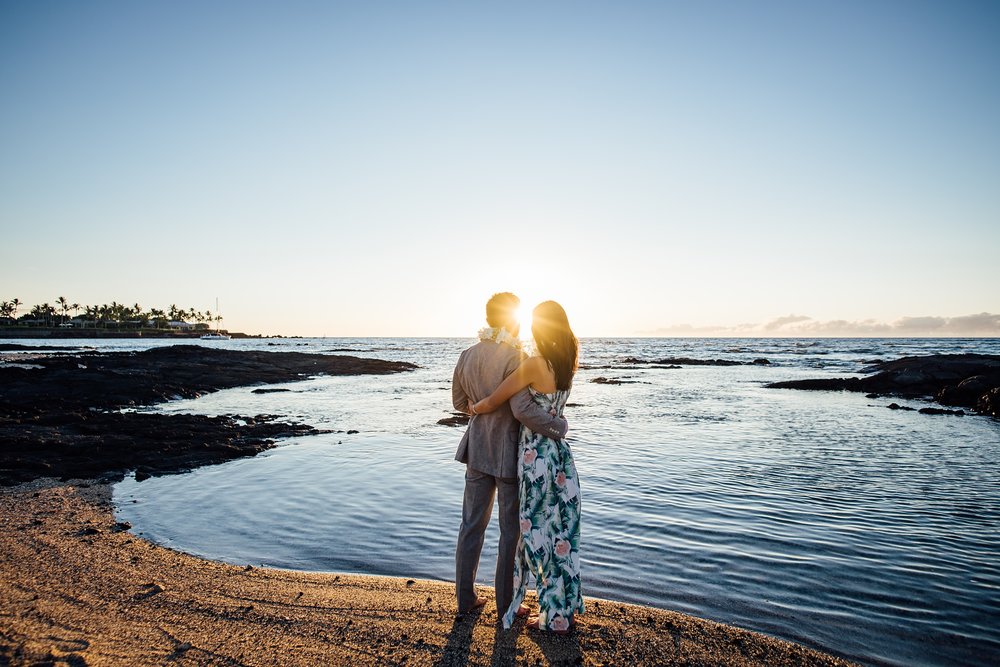 couple embracing each other during golden hour at the beach