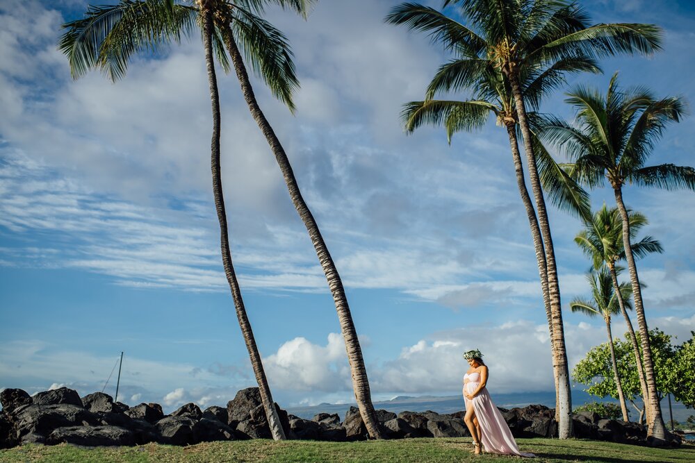 pregnant lady under the palm trees at Mauna lani