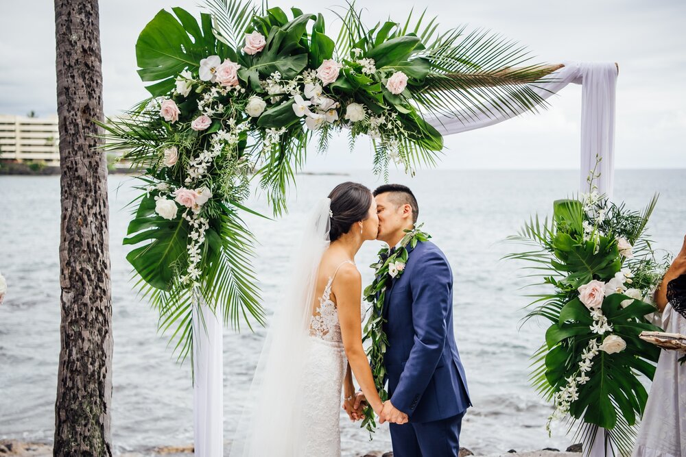bride and groom kiss during Big Island wedding ceremony