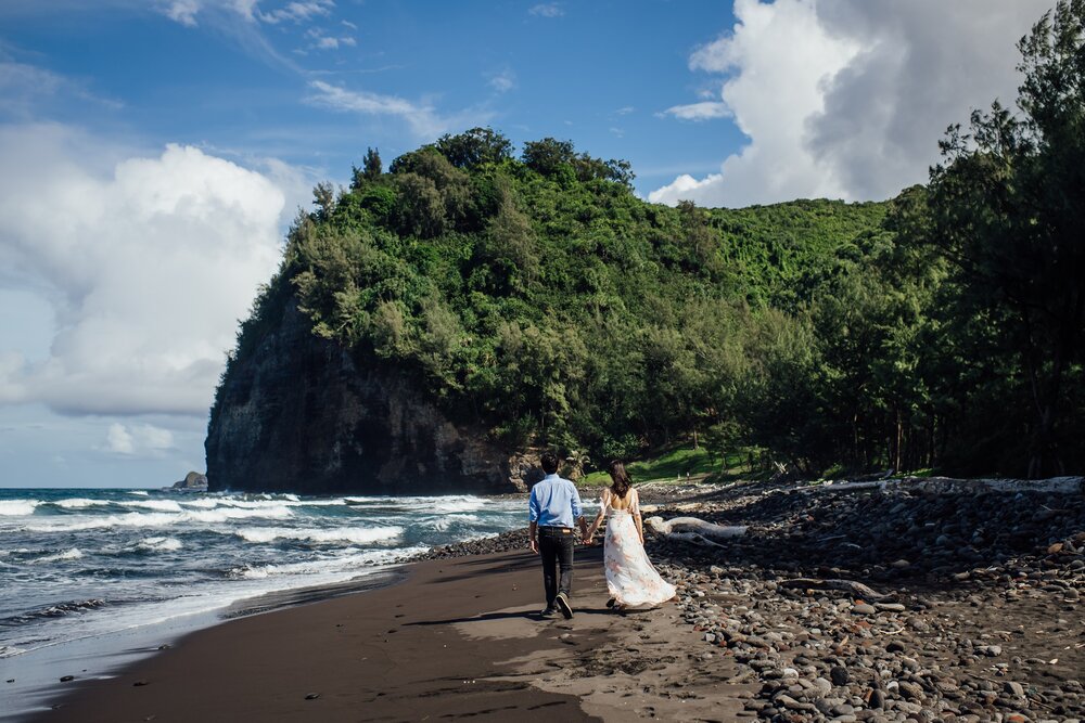 couple holding hands by Big Island elopement photographer