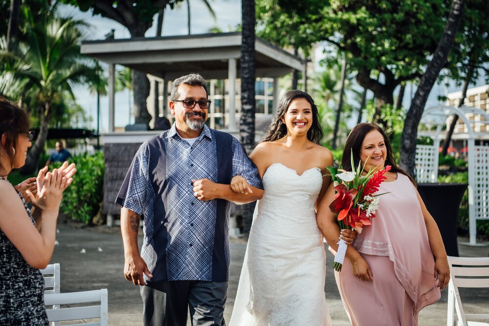 Bride's parents walk her down the aisle on her wedding day, Hawaii wedding photographer