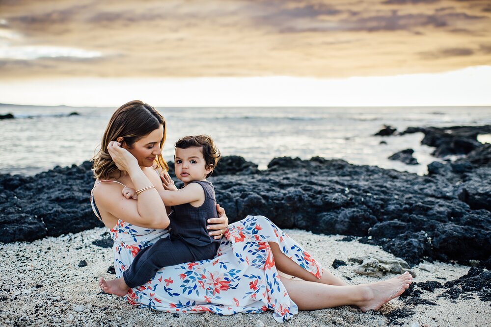 candid mom and son moments during family photography at the beach