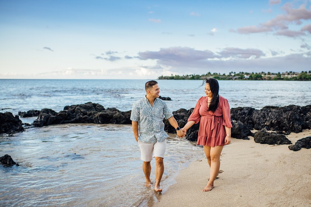 bride and groom walking on the beach during hawaii engagement session