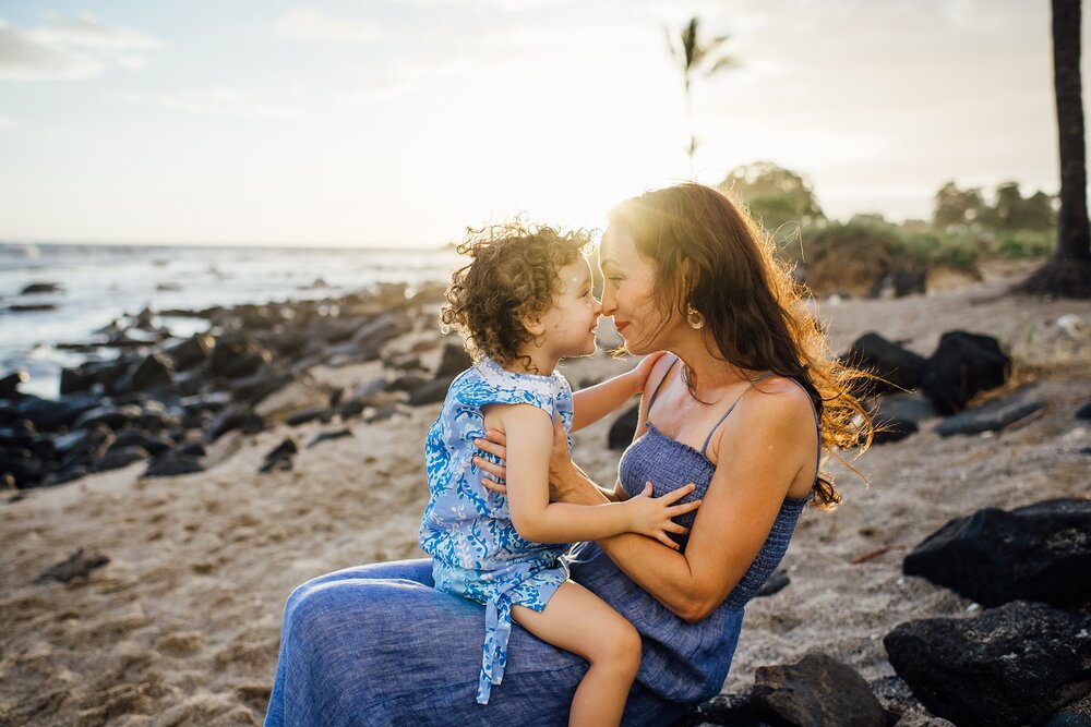 mom and daughter nose-to-noses during Big Island sunset