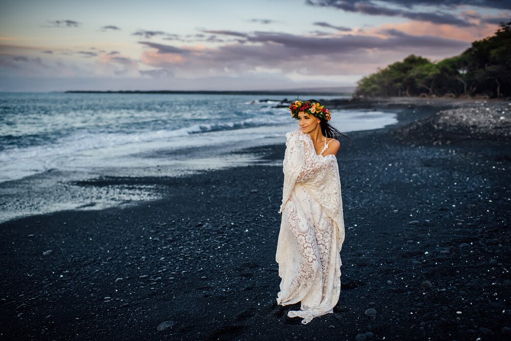 colorful sunset for hawaii wedding on black sand beach on the big island