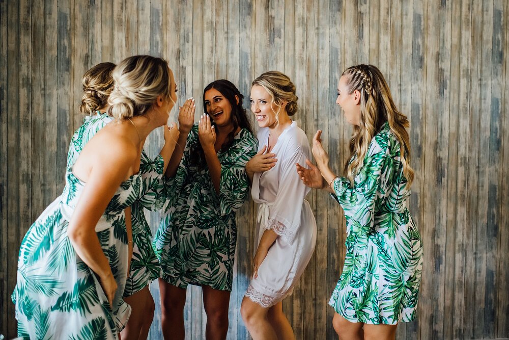 bride enjoying a laugh with her friends before her wedding in hawaii