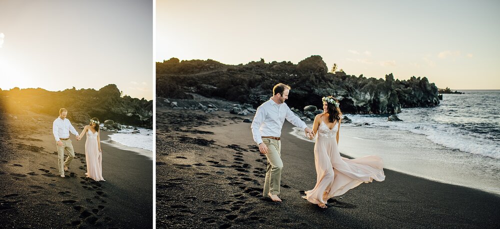 couple walking at the black sand beach by wedding photographer