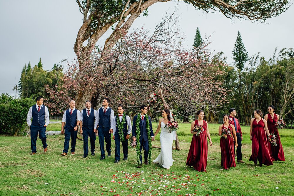 candid photo of the entire wedding party by Hawaii photographer