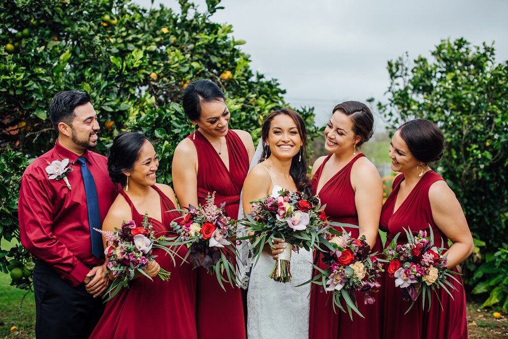 red-themed bridal party by Hawaii wedding photographer