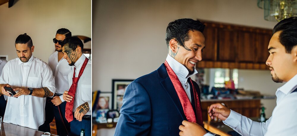 groom tying his necktie with groomsman's help
