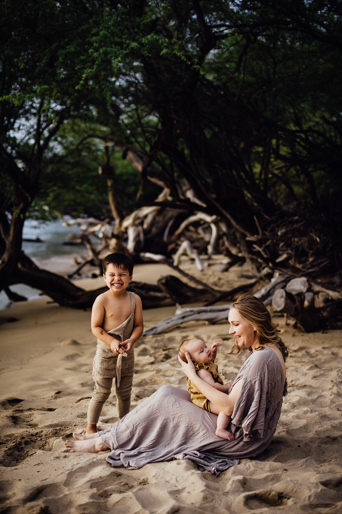 family having fun during their photo session at Hawaii beach