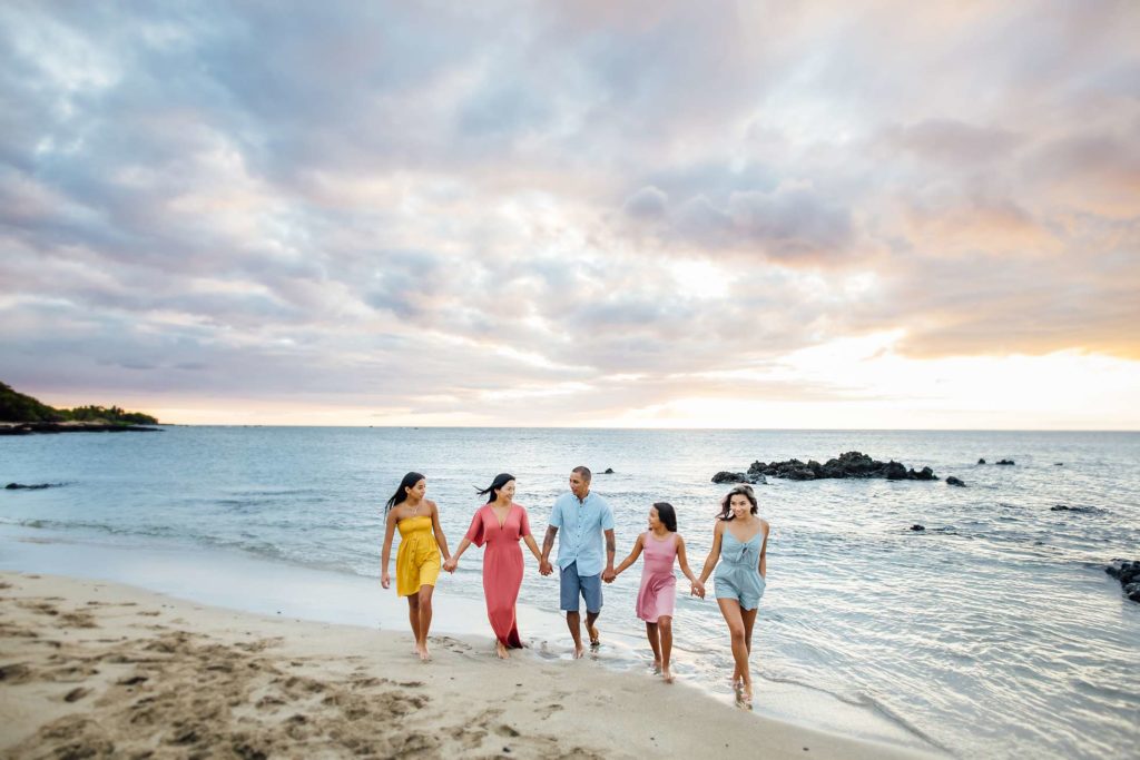 family holding hands at the beach by Hawaii photographer