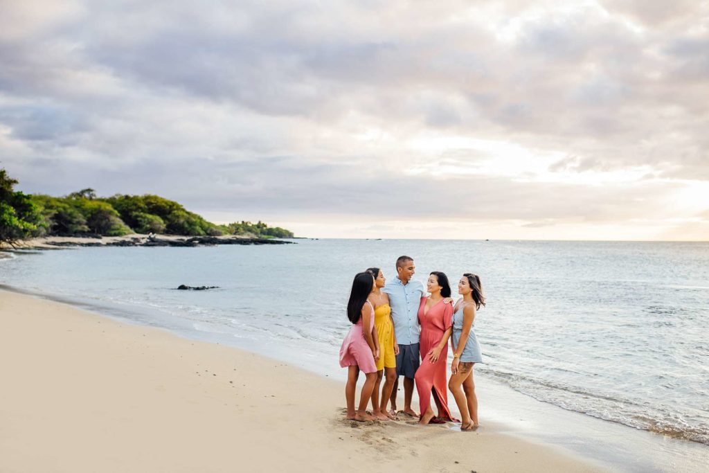 happy family standing during beach  sunset by Hawaii photographer