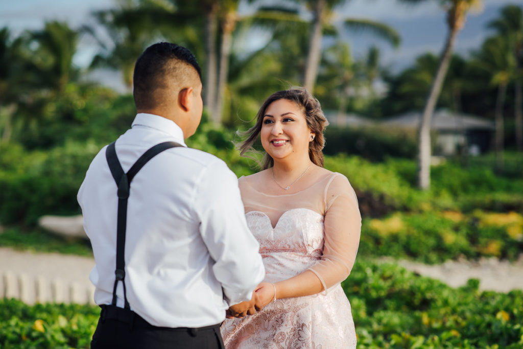 couple holding hands during their Big Island wedding