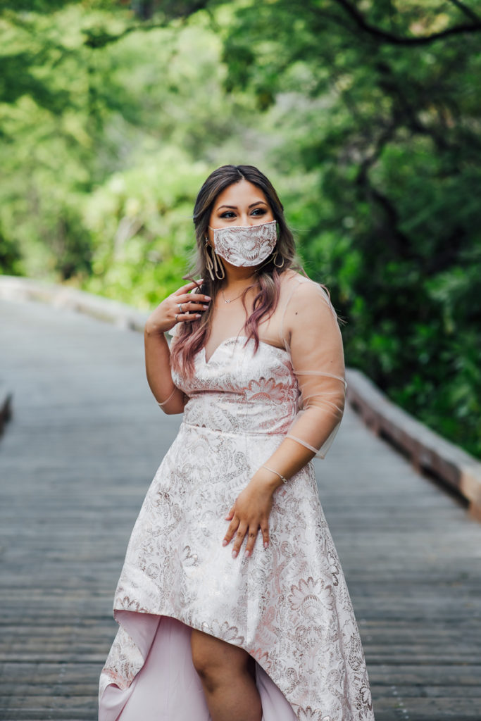 bride wearing a mask that matches her dress