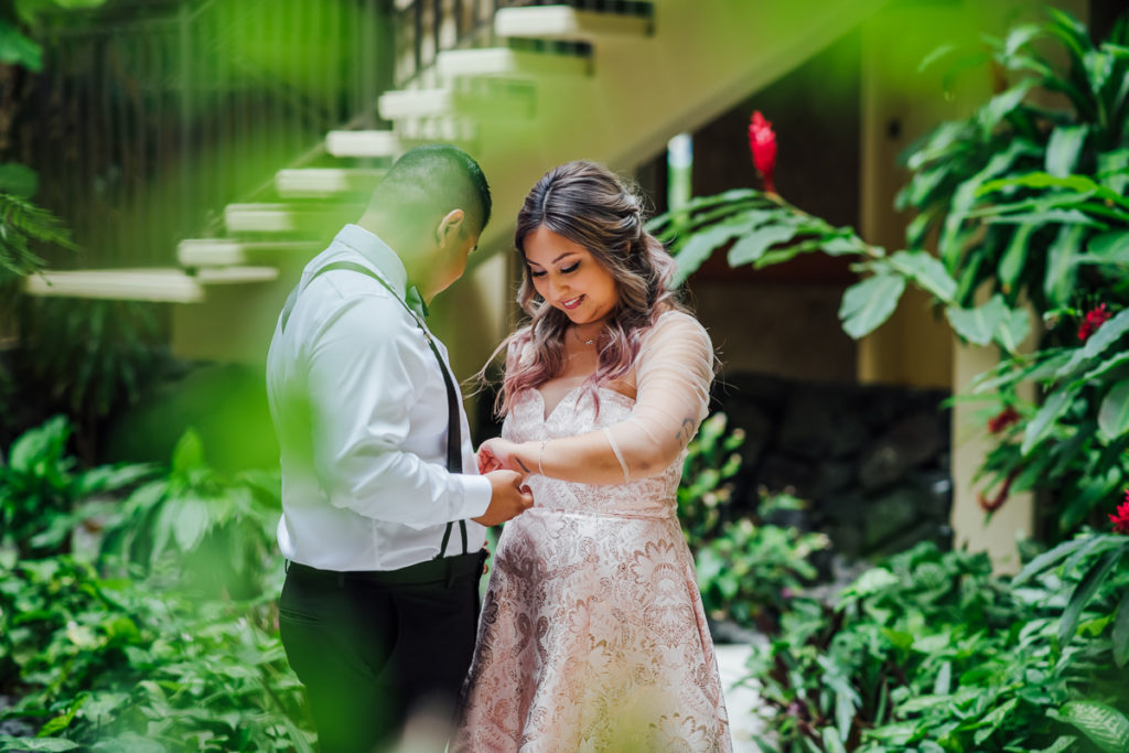 bride and groom during their first look by wedding photographer