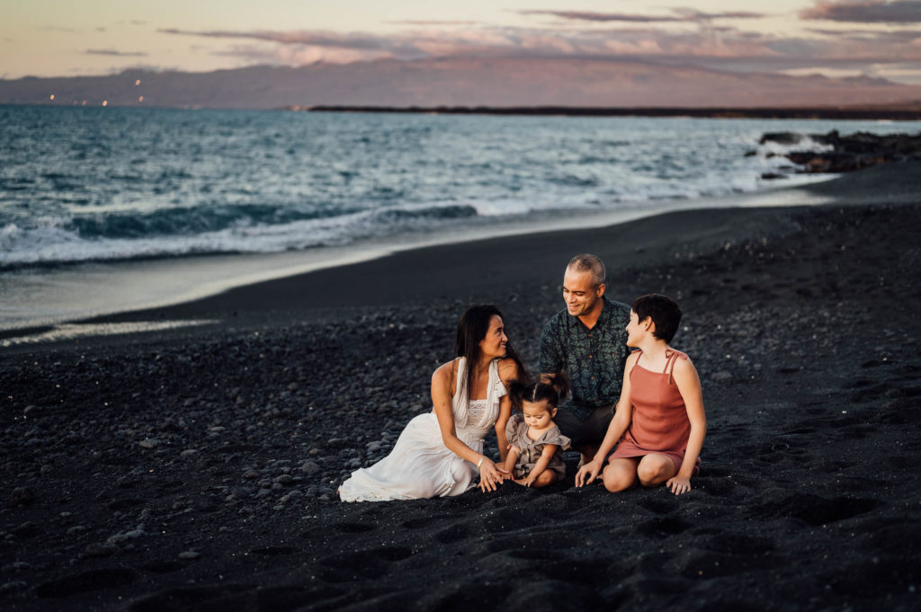 family's candid moments at black beach by Big Island photographer