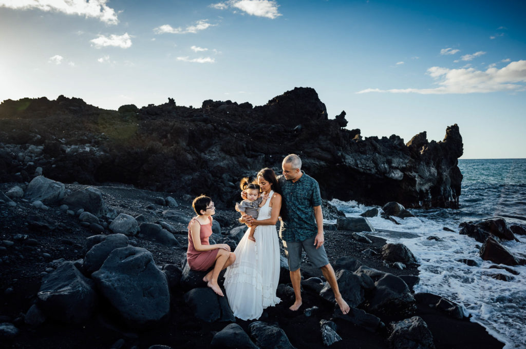 family at the black sand beach by Big Island photographer