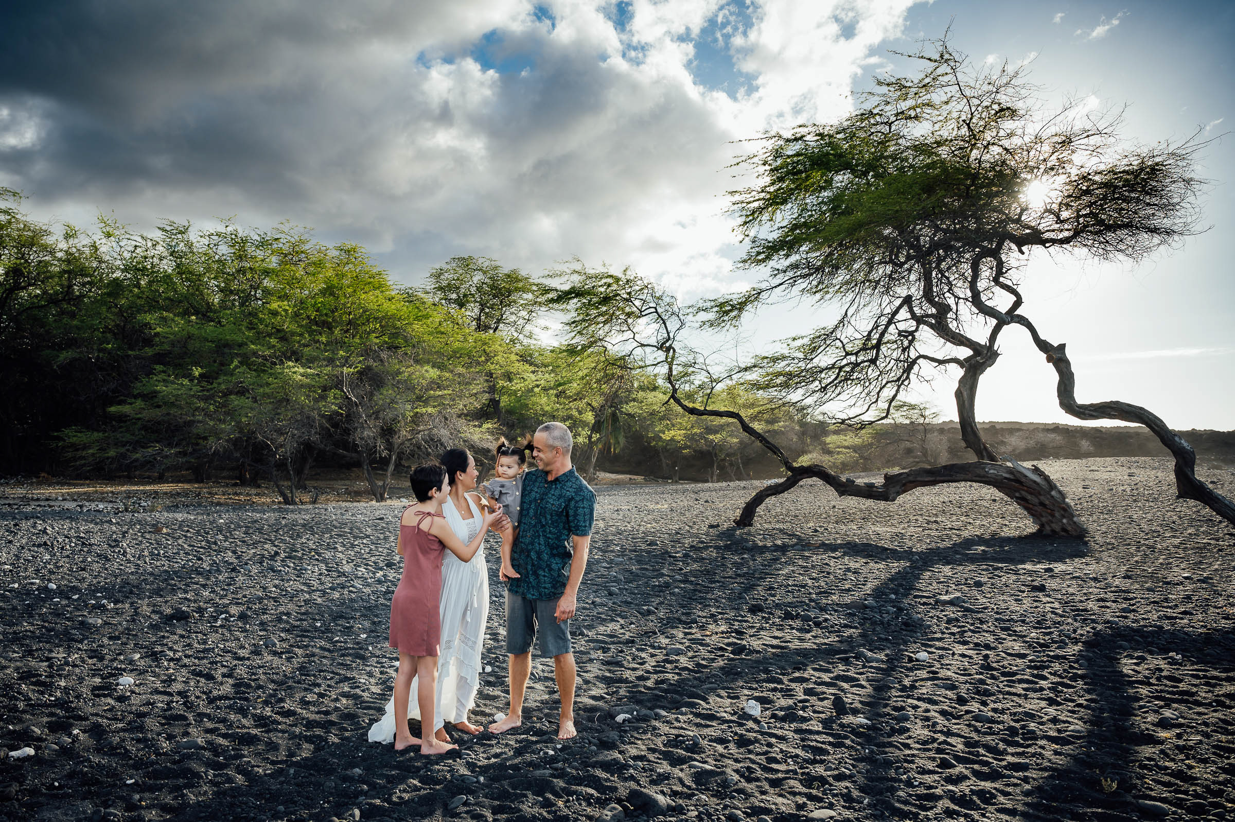 wonderful family quality time on black sand with trees