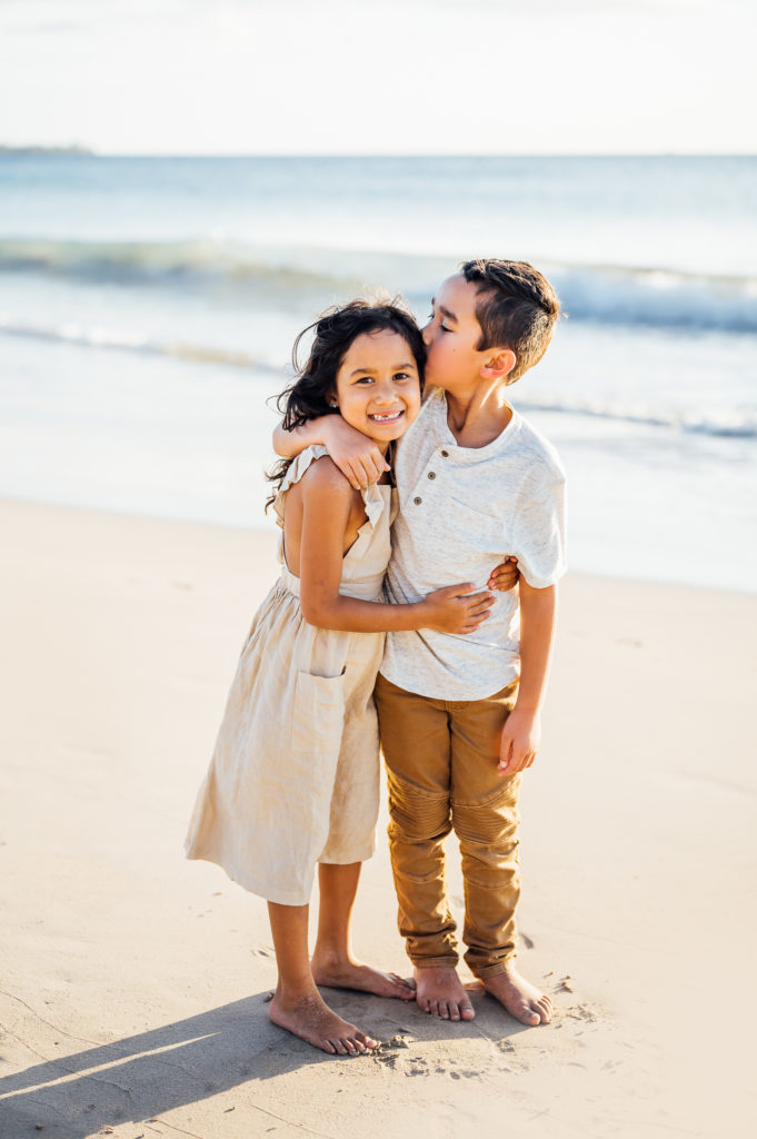 sweet siblings during family vacation by Big Island photographer