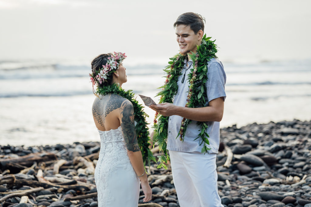 groom reading his vows during their Hawaii elopement ceremony
