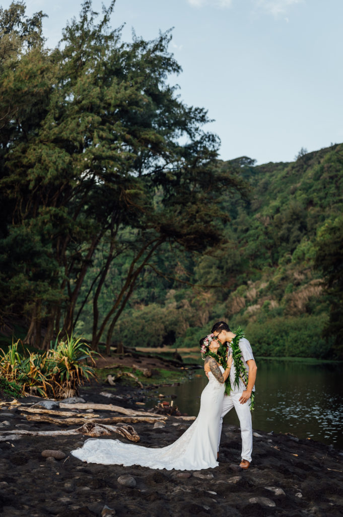newlyweds about to kiss by a riverside at Big Island
