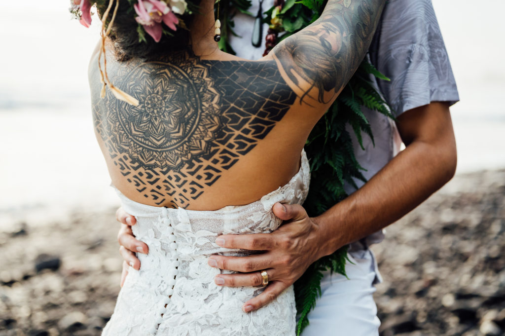 beautiful and intricate back tattoo of the bride
