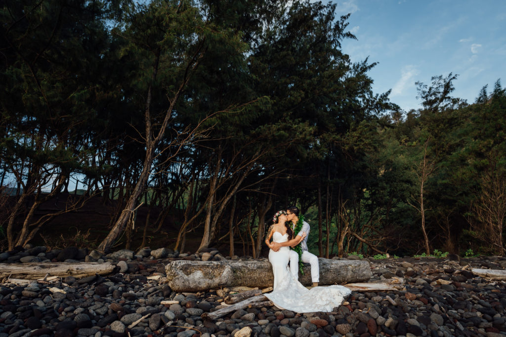 bride and groom kissing in the forest at Big Island