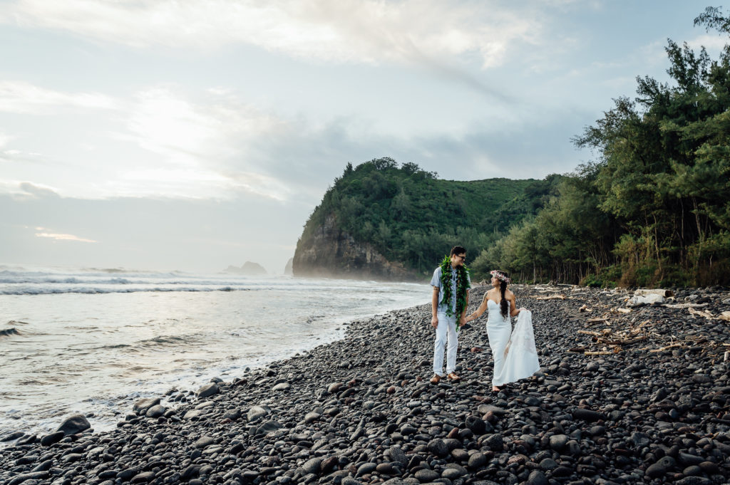 wedding couple walking on the shore during adventure elopement