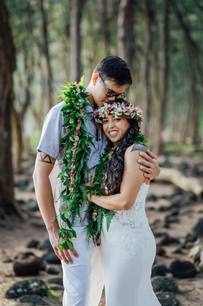 sweet couple under the trees during their Hawaii elopement
