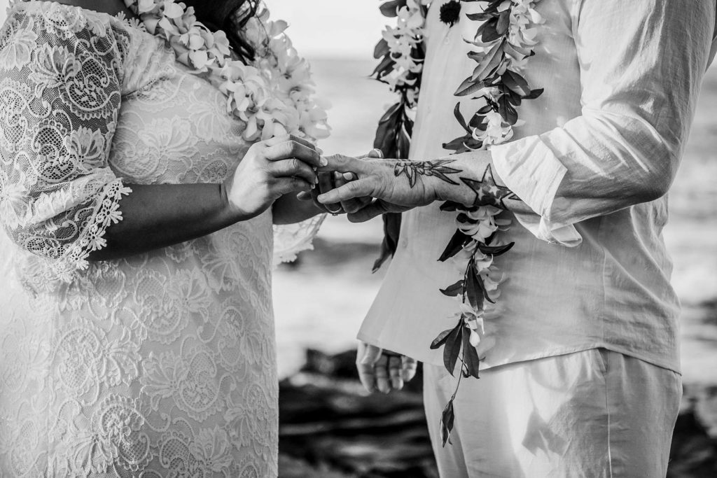 exchanging of rings during Hawaii wedding ceremony