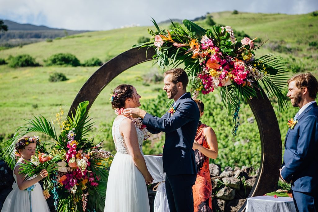 groom putting the lei on the bride at Anna Ranch 