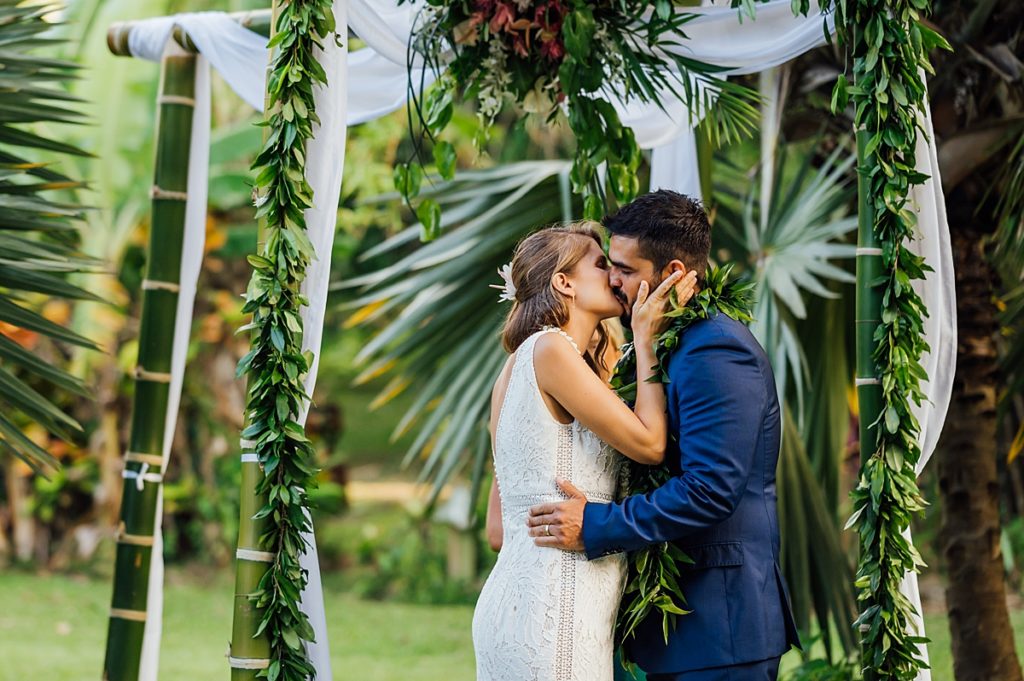 wedding photo of the bride and groom kissing during a Big Island wedding ceremony