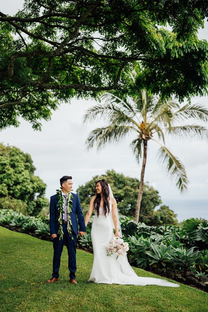 wedding photo of the bride and groom holding hands during their Big Island wedding