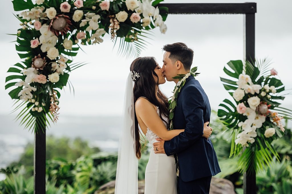 wedding of the bride and groom kissing after their Big Island wedding ceremony