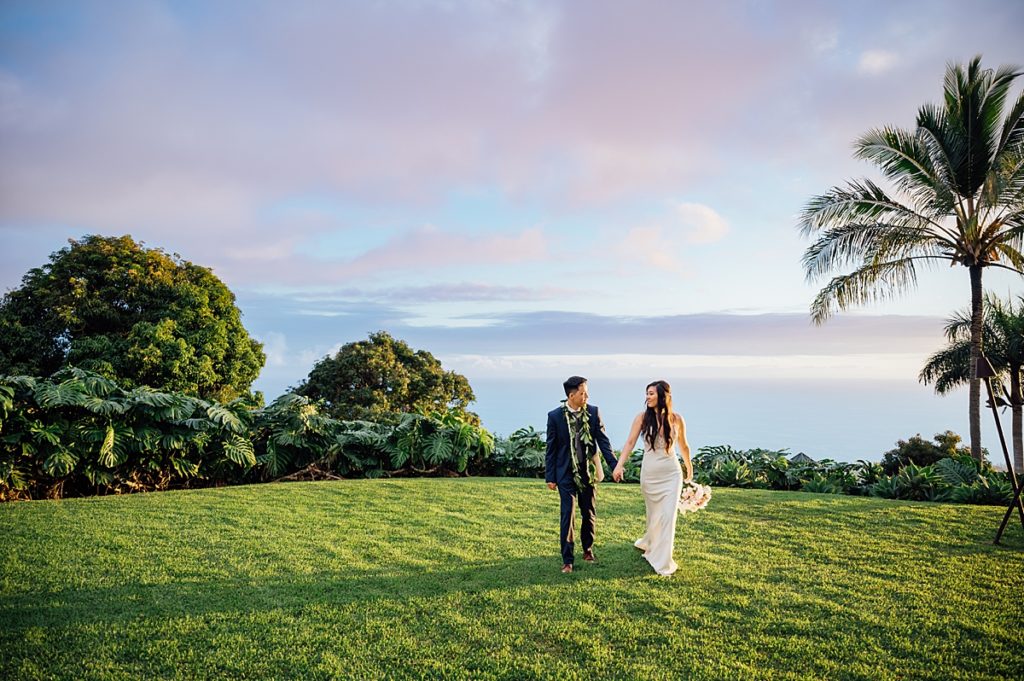 photo of bride and groom holding hands during their Big Island wedding