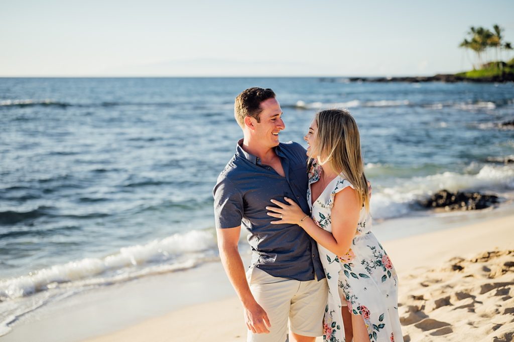 couple looking happily at each other during Hawaii engagement