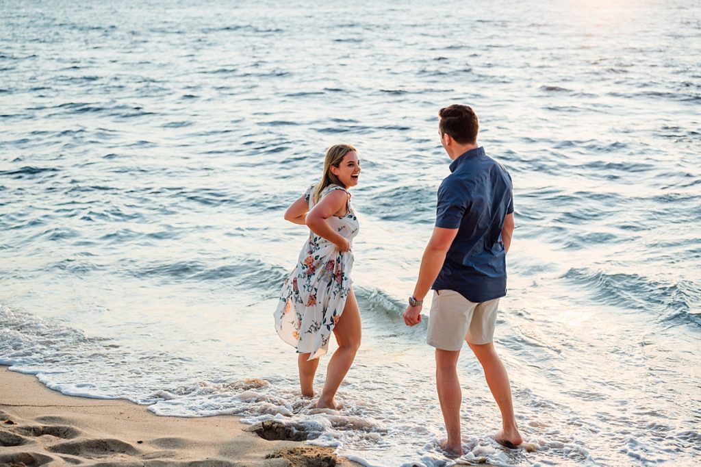 couple dipping their toes in the waters