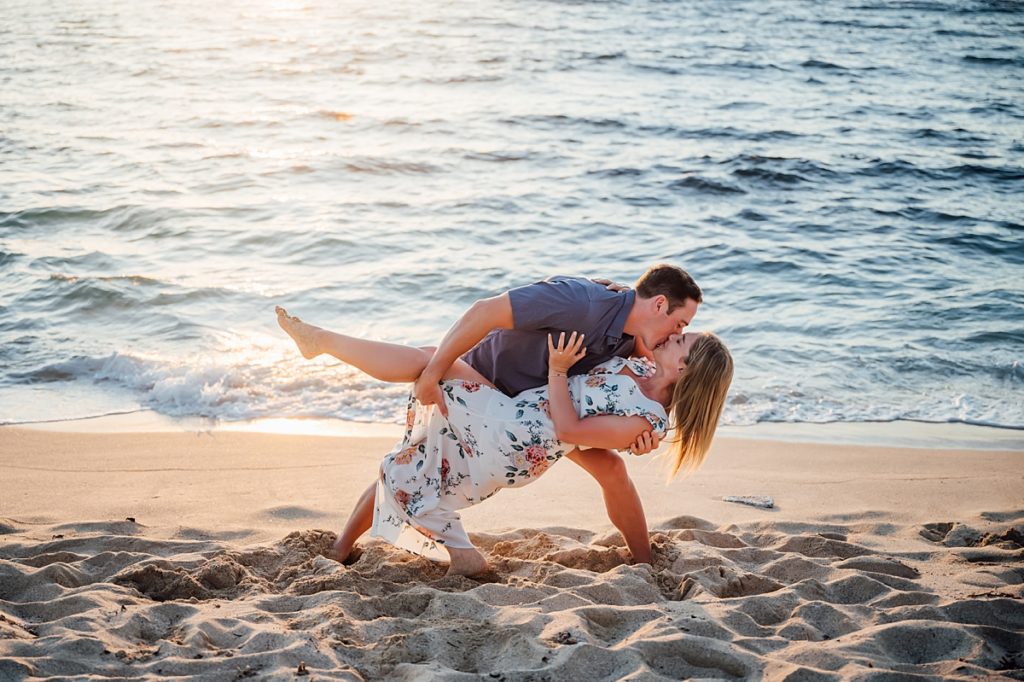 couple kissing at the beach during their Hawaii engagement