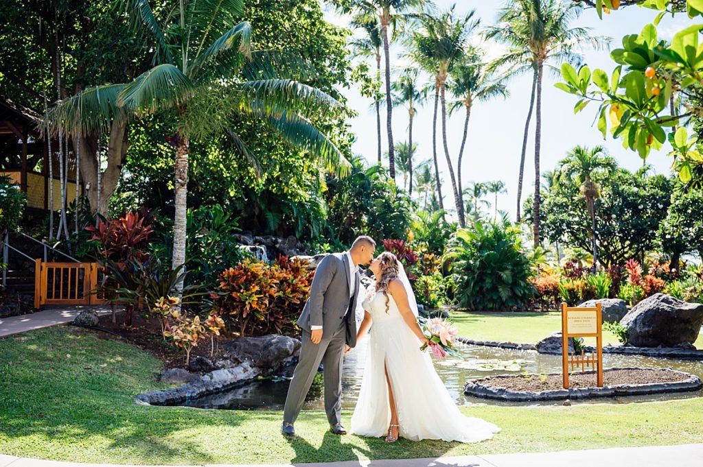 bride and groom kissing during their Hawaii wedding