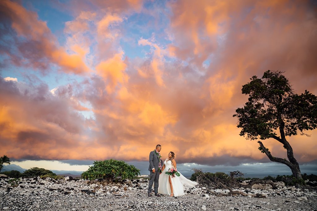 stunning golden sunset during a Big Island wedding by Ann Ferguson