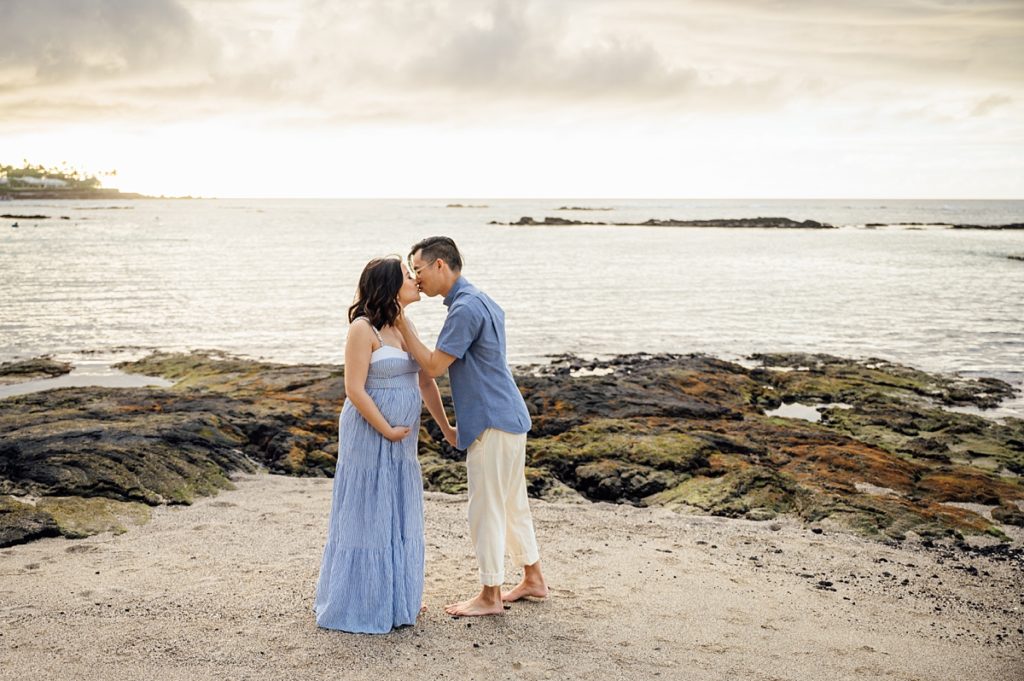 couple kissing at the beach by Kona photographer